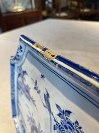 A blue and white Dutch Delft chinoiserie plaque with a tea drinking scene, 18th C.