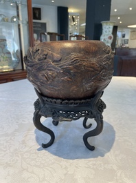 A Chinese agarwood brush washer with landscape relief design on wooden stand, 17/18th C.