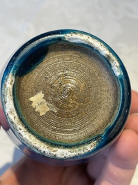 Three Chinese turquoise-glazed vases and a turquoise and aubergine-glazed Buddhist lion, Kangxi