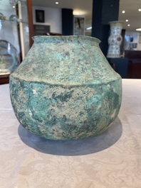 A bronze urn, a bronze canteen with relief design and a pair of bronze oil lamps, Roman Empire, 9th C. B.C/5th C.