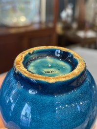 Three Chinese turquoise-glazed vases and a turquoise and aubergine-glazed Buddhist lion, Kangxi