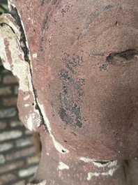 A Thai red sandstone head of Buddha, possibly Ayutthaya period, 15th C.