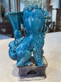 Three Chinese turquoise-glazed vases and a turquoise and aubergine-glazed Buddhist lion, Kangxi