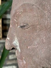 A Thai red sandstone head of Buddha, possibly Ayutthaya period, 15th C.