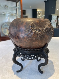 A Chinese agarwood brush washer with landscape relief design on wooden stand, 17/18th C.