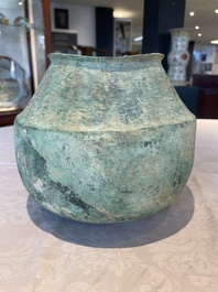 A bronze urn, a bronze canteen with relief design and a pair of bronze oil lamps, Roman Empire, 9th C. B.C/5th C.