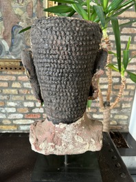 A Thai red sandstone head of Buddha, possibly Ayutthaya period, 15th C.