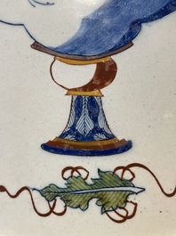 A fine polychrome Dutch Delft 'flower vase' plaque, 18th C.