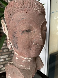 A Thai red sandstone head of Buddha, possibly Ayutthaya period, 15th C.