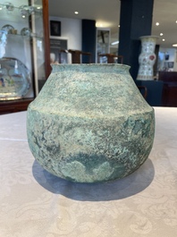 A bronze urn, a bronze canteen with relief design and a pair of bronze oil lamps, Roman Empire, 9th C. B.C/5th C.