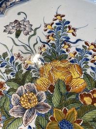 A fine polychrome Dutch Delft 'flower vase' plaque, 18th C.