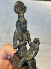 A varied collection of five bronze figures and utensils, Egypt, 3rd/1st C. B.C.