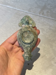 A bronze urn, a bronze canteen with relief design and a pair of bronze oil lamps, Roman Empire, 9th C. B.C/5th C.