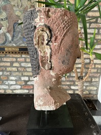 A Thai red sandstone head of Buddha, possibly Ayutthaya period, 15th C.