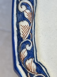 A fine polychrome Dutch Delft 'flower vase' plaque, 18th C.