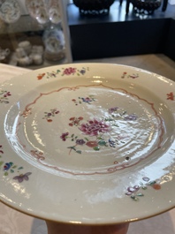 A collection of 22 Chinese famille rose and Imari-style plates, 18th C.