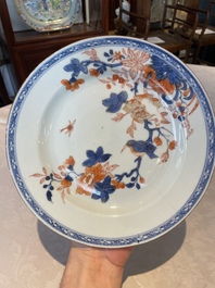 A group of thirteen Chinese blue, white and famille rose plates and a bowl, late Ming/early Qing