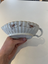 A Chinese famille rose black-ground teapot with cover and stand and a sauce boat, Qianlong