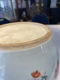 A pair of fine Chinese famille rose 'botanical Merian-style' jars with wooden covers, Qianlong