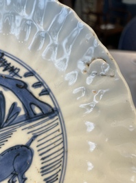 A group of thirteen Chinese blue, white and famille rose plates and a bowl, late Ming/early Qing