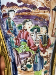 A pair of Chinese Canton famille rose 'mandarin subject' vases with gilt bronze mounts, Qianlong