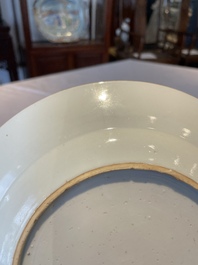 A group of thirteen Chinese blue, white and famille rose plates and a bowl, late Ming/early Qing