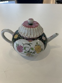 A Chinese famille rose black-ground teapot with cover and stand and a sauce boat, Qianlong