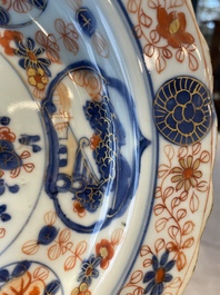 A group of thirteen Chinese blue, white and famille rose plates and a bowl, late Ming/early Qing