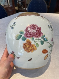 A pair of fine Chinese famille rose 'botanical Merian-style' jars with wooden covers, Qianlong
