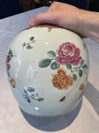 A pair of fine Chinese famille rose 'botanical Merian-style' jars with wooden covers, Qianlong