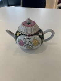 A Chinese famille rose black-ground teapot with cover and stand and a sauce boat, Qianlong