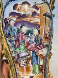 A pair of Chinese Canton famille rose 'mandarin subject' vases with gilt bronze mounts, Qianlong