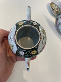 A Chinese famille rose black-ground teapot with cover and stand and a sauce boat, Qianlong