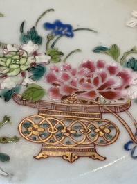 A collection of 22 Chinese famille rose and Imari-style plates, 18th C.