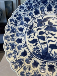 A group of thirteen Chinese blue, white and famille rose plates and a bowl, late Ming/early Qing