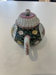 A Chinese famille rose black-ground teapot with cover and stand and a sauce boat, Qianlong