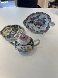 A Chinese famille rose black-ground teapot with cover and stand and a sauce boat, Qianlong