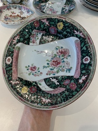 A pair of Chinese famille rose black-ground 'flowers and scrolls' plates, Yongzheng/Qianlong