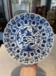 A group of thirteen Chinese blue, white and famille rose plates and a bowl, late Ming/early Qing