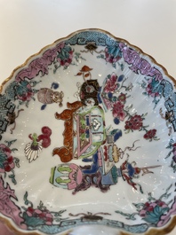 A Chinese famille rose black-ground teapot with cover and stand and a sauce boat, Qianlong