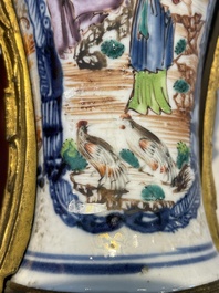 A pair of Chinese Canton famille rose 'mandarin subject' vases with gilt bronze mounts, Qianlong