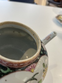 A Chinese famille rose black-ground teapot with cover and stand and a sauce boat, Qianlong