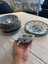 A group of thirteen Chinese blue, white and famille rose plates and a bowl, late Ming/early Qing