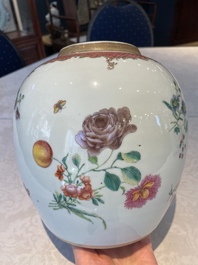 A pair of fine Chinese famille rose 'botanical Merian-style' jars with wooden covers, Qianlong