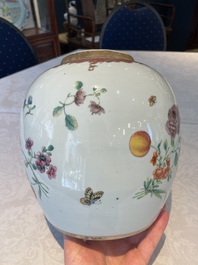 A pair of fine Chinese famille rose 'botanical Merian-style' jars with wooden covers, Qianlong