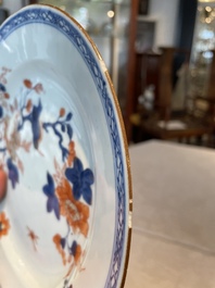 A group of thirteen Chinese blue, white and famille rose plates and a bowl, late Ming/early Qing