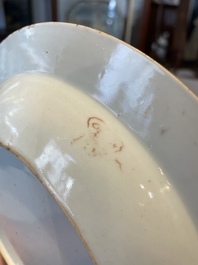 A group of thirteen Chinese blue, white and famille rose plates and a bowl, late Ming/early Qing