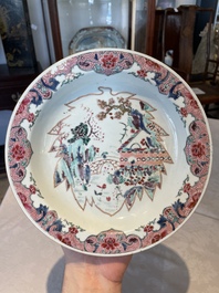 A group of thirteen Chinese blue, white and famille rose plates and a bowl, late Ming/early Qing