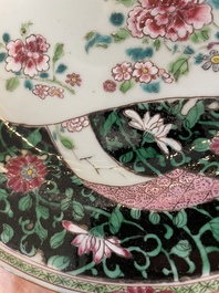 A pair of Chinese famille rose black-ground 'flowers and scrolls' plates, Yongzheng/Qianlong