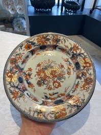 A collection of 22 Chinese famille rose and Imari-style plates, 18th C.